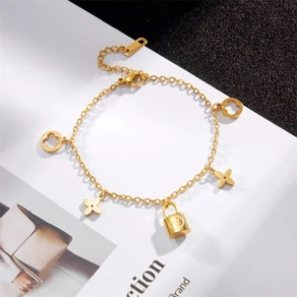 18K Gold Designer Charm Bracelet with Lock and Flower Accents - Picture 8 of 8